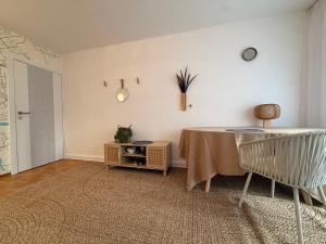 a dining room with a table and a chair at Sloth Room in Warsaw +25 photos