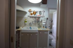 a small kitchen with a sink and a toilet at B&B Sant'Agata Appartamento in Sant'Agata de' Goti +33 photos