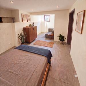 a bedroom with a bed and a living room at Gador Sea View in H̱adera