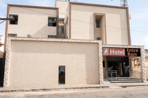a building with an entrance to a hotel at Hotel Entre Rios in Pontalina