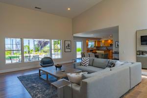 a living room with a couch and a table at Hilltop Oasis in Templeton
