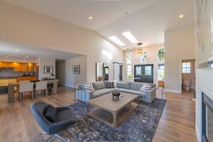 a living room with a couch and a table at Hilltop Oasis in Templeton