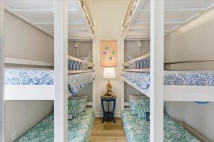 a couple of bunk beds in a room at Modern Lakefront Escape | The Twelve in Camdenton
