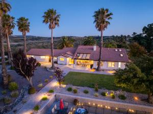 an aerial view of a house with palm trees at Hilltop Oasis in Templeton