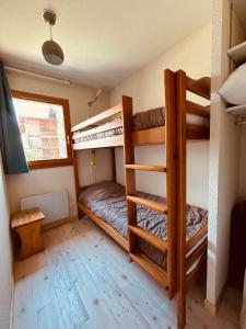 two bunk beds in a room with a bed at Le Chalet de Super D in Le Dévoluy +9 photos