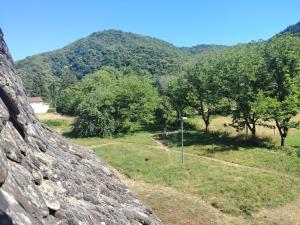 a view of a field from a rock wall at Lo Castel de Lasmaries in Saint-Parthem