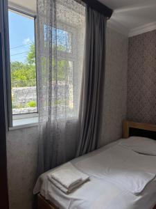 a bedroom with a bed and a window at EleGaya Guest house in Ijevan