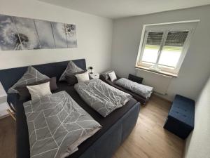 a living room with a couch and a bed at Casa-Heckl in Tutzing