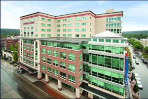 an overhead view of a large building on a city street at Hilton Garden Inn Ithaca in Ithaca