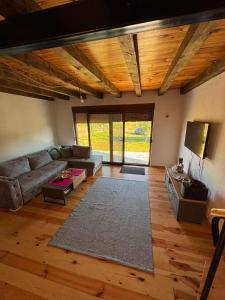 a living room with a couch and a rug at Gabriels7 in Korita +14 photos