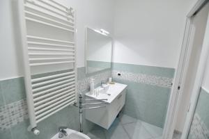 a bathroom with a sink and a mirror at Casa Vacanze Andromeda in Agerola +47 photos