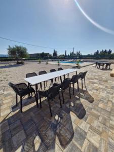 a picnic table and chairs sitting on a patio at Villa Jopi in Neum