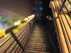 a stairway with flowers on it at night at Cabaña la Valkiria in Falan