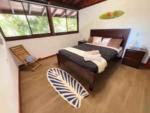 a bedroom with a bed and a large window at Pacheco Villa in Drake