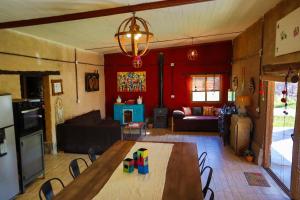 a kitchen and living room with a table and chairs at Marta Maria in El Rodeo