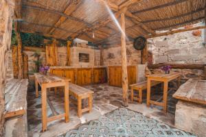 a room with wooden tables and benches in a building at Adali Aparts in Side