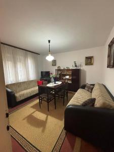 a living room with a couch and a table at Vila Vuković in Leskovac