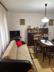 a living room with a couch and a table at Vila Vuković in Leskovac