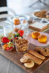 a table topped with different types of food and snacks at Agrirelais Collelago in Massignano +76 photos