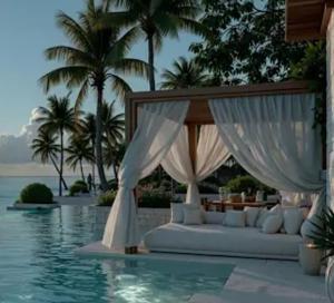 a bed in the middle of a pool at Cozy loft with Stunning Sea View in Palm-Mar