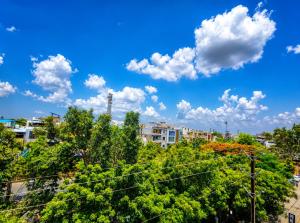 a view of a city with trees and buildings at Parth Paradise Hotel in Indore