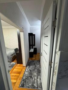 a hallway with a room with a bed and a door at Avenue B&B in Vanadzor