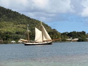 a sail boat in the water on a lake at Fare Maeva in Paopao +7 photos