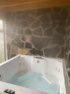a bath tub with water coming out of it at Cabaña sueño real in Mazamitla +24 photos