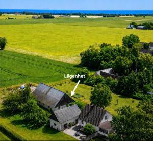 an aerial view of an old barn in a field at Gästis in Borrby +3 photos