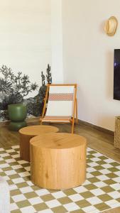 a living room with a table and a chair at Cap Almyra, on Lavasina Beach, Erbalunga in Brando