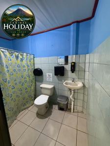 a bathroom with a toilet and a sink at Holiday San Jorge in Fortuna