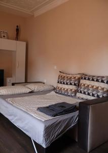 two beds sitting in a room with at Central apartments Pleven in Pleven