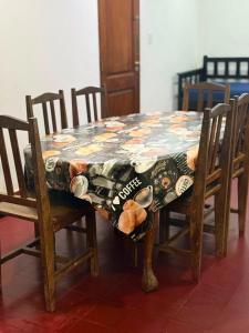 a table with a table cloth on top of it at Casa familiar in Corrientes