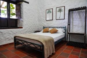 a bedroom with a bed and a window at Casa Luna Hotel Campestre & Spa in San Gil +63 photos