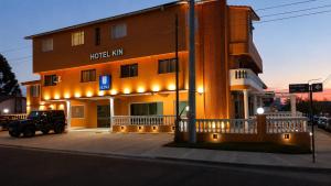 a hotel inn with a truck parked in front of it at KIN Hotel in Villa Carlos Paz