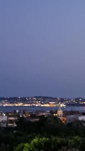 a view of a city at night with lights at Affitti Brevi da Rita in Monte di Procida