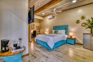 a bedroom with a bed and a flat screen tv at Hotel Palma Royale in Bocas Town +113 photos