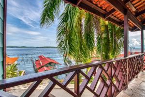 a view of the water from the balcony of a house at Hotel Palma Royale in Bocas Town