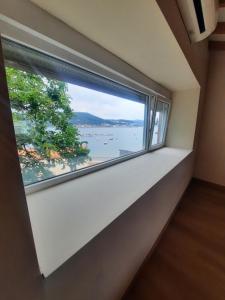 a window in a room with a view of the water at Vista Real in Mugardos