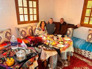 a group of three people sitting around a table at Dar Imoughlad in Marrakesh +291 photos