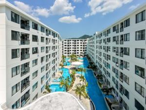 an aerial view of two apartment buildings with a pool at New Capri Condo in Bang Tao by Lofty in Ban Thalat Choeng Thale
