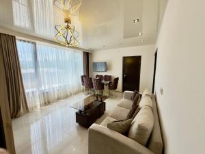 a living room with a couch and a dining room at Home Ler in Yeghipatrush