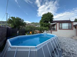 a swimming pool in the backyard of a house at Home Ler in Yeghipatrush