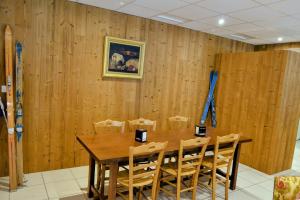 a wooden dining room with a table and chairs at Abries Hôtel in Abriès +38 photos