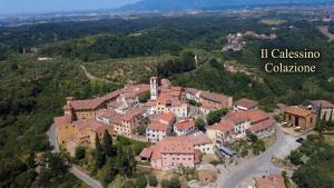 an aerial view of a small town with houses at Borgo antico Pisa in Montecastello
