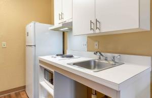 a kitchen with a sink and a refrigerator at Extended Stay America Suites - Frederick - Westview Dr in Frederick