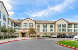 a large building with cars parked in a parking lot at Extended Stay America Suites - Fairfield - Napa Valley in Fairfield