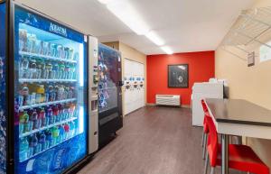 a room with a refrigerator filled with soda bottles at Extended Stay America Suites - Fairfield - Napa Valley in Fairfield