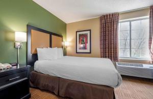 a hotel room with a bed and a window at Extended Stay America Suites - Minneapolis - Eden Prairie - Technology Drive in Eden Prairie +55 photos
