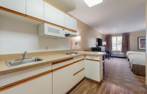 a kitchen with a sink and a bed in a room at Extended Stay America Suites - Minneapolis - Eden Prairie - Technology Drive in Eden Prairie